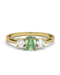 ANILLO OSIRIS DE ORO Y TOPACIOS BLANCOS EN 4 GARRAS DE 3MM Y CENTRO PERIDOTO 5X4MM - CRESBER