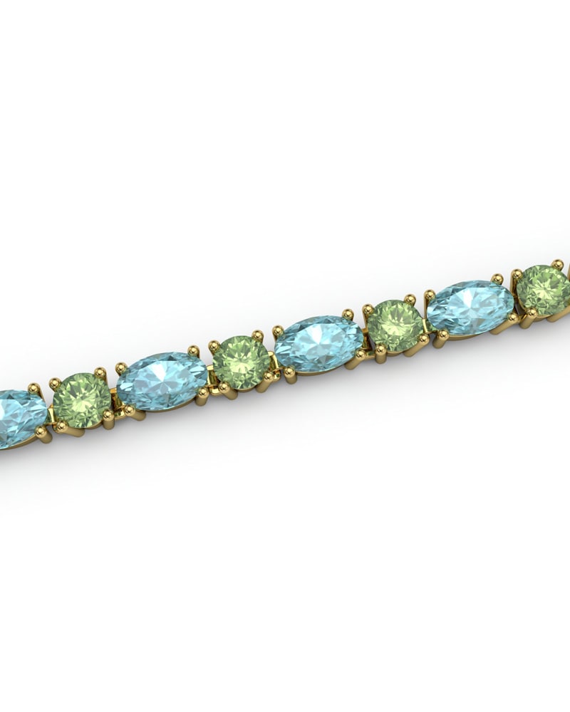 PULSERA FALLS ORO TOPACIO AZUL Y PERIDOTO - CRESBER