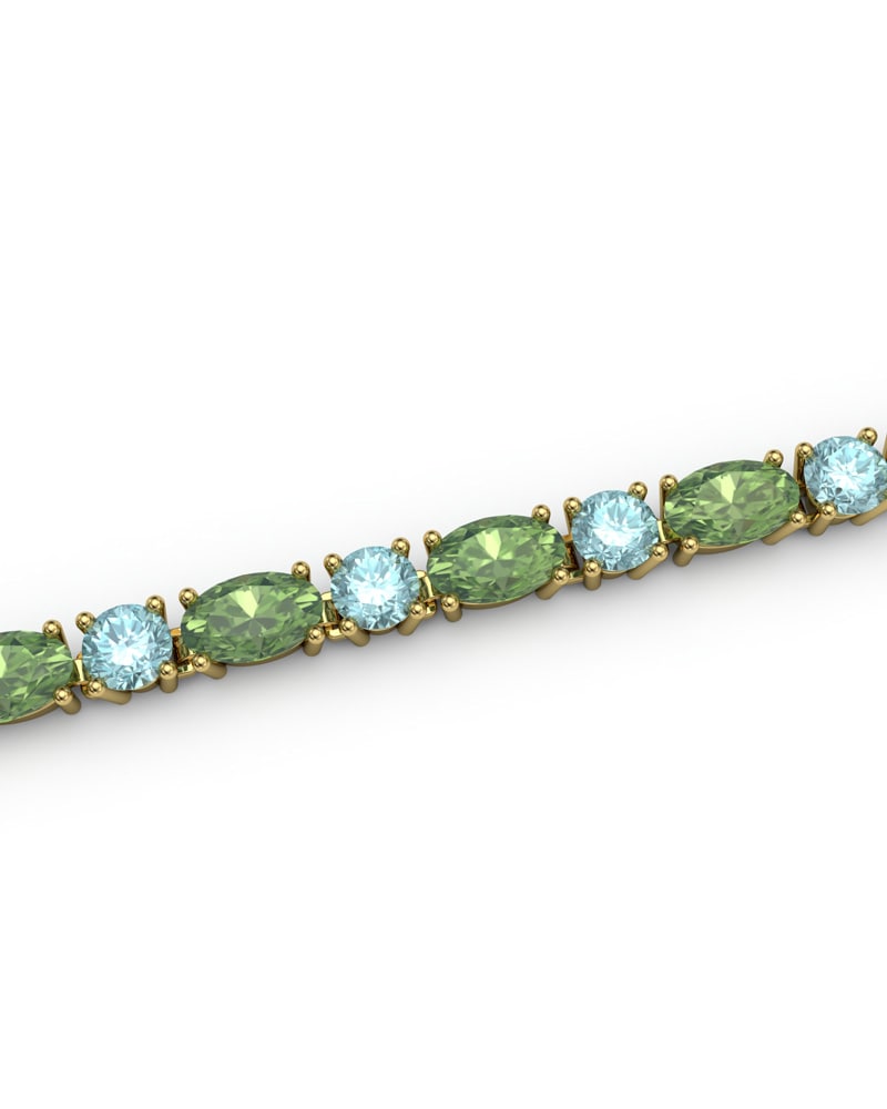 PULSERA FALLS ORO PERIDOTO Y TOPACIO AZUL - CRESBER