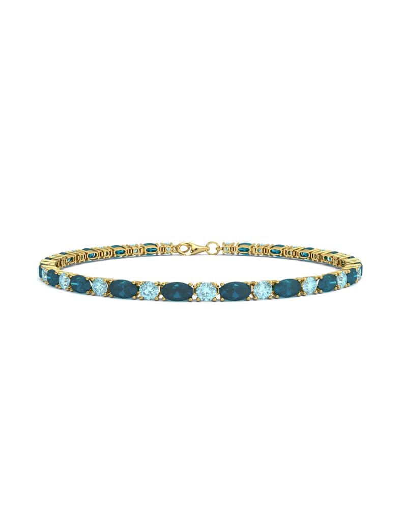 PULSERA FALLS ORO LONDON Y TOPACIO AZUL - CRESBER