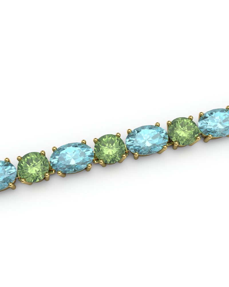 PULSERA FALLS ORO TOPACIO AZUL Y PERIDOTO - CRESBER