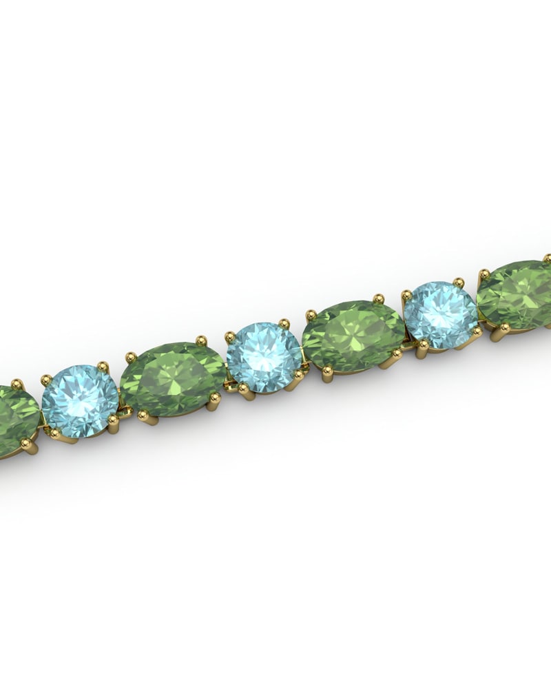 PULSERA FALLS ORO PERIDOTO Y TOPACIO AZUL - CRESBER