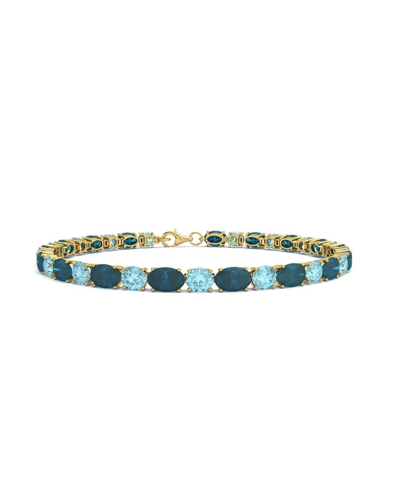 PULSERA FALLS ORO LONDON Y TOPACIO AZUL - CRESBER